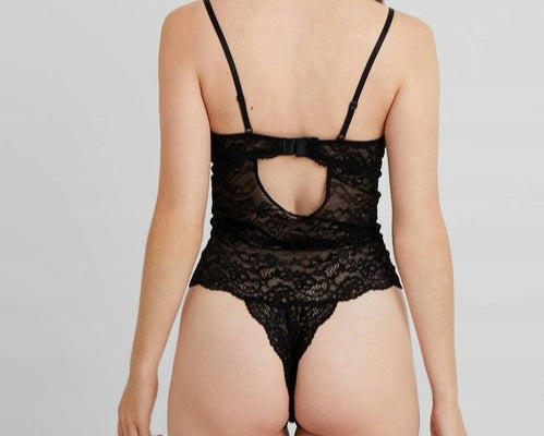 Black lace lingerie set on a plain background